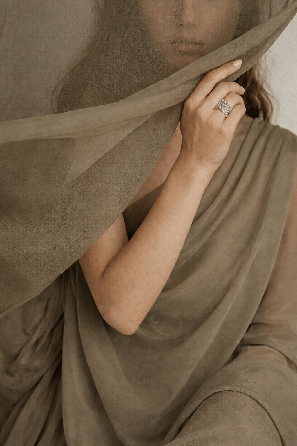 New Arrivals — model with sheer scarf and silver ring